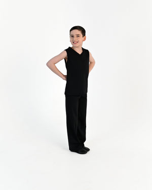 Young dancer wearing the Essential Boys Straight Leg Dance Pant in Black, alternate view
