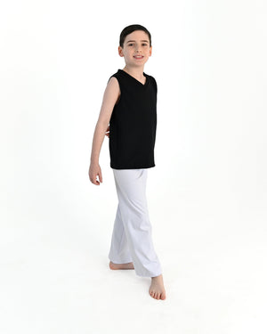 Young dancer wearing the Essential Boys Dance Tank in Black