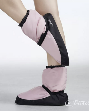 Dusk pink warm up booties worn on pointed feet