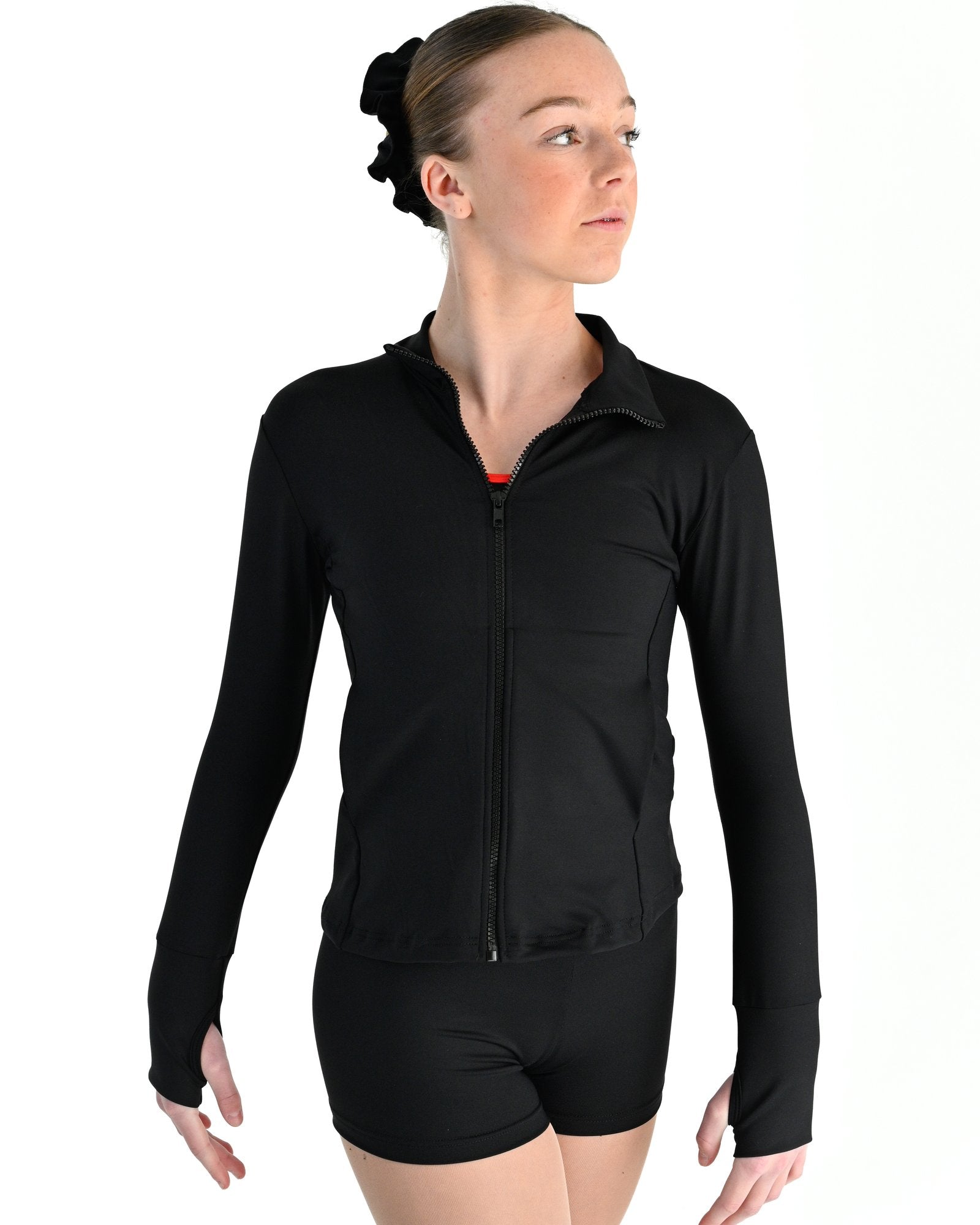Young dancer wearing the Academy fitted zip front warm up dance jacket in Black