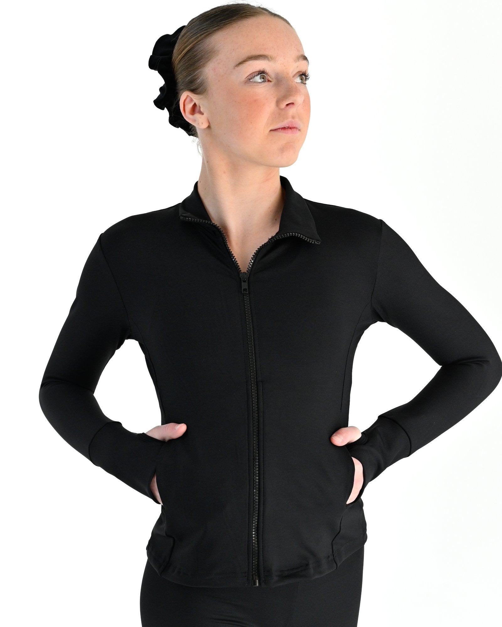 Young dancer wearing the Academy fitted zip front warm up dance jacket in Black, alternate view