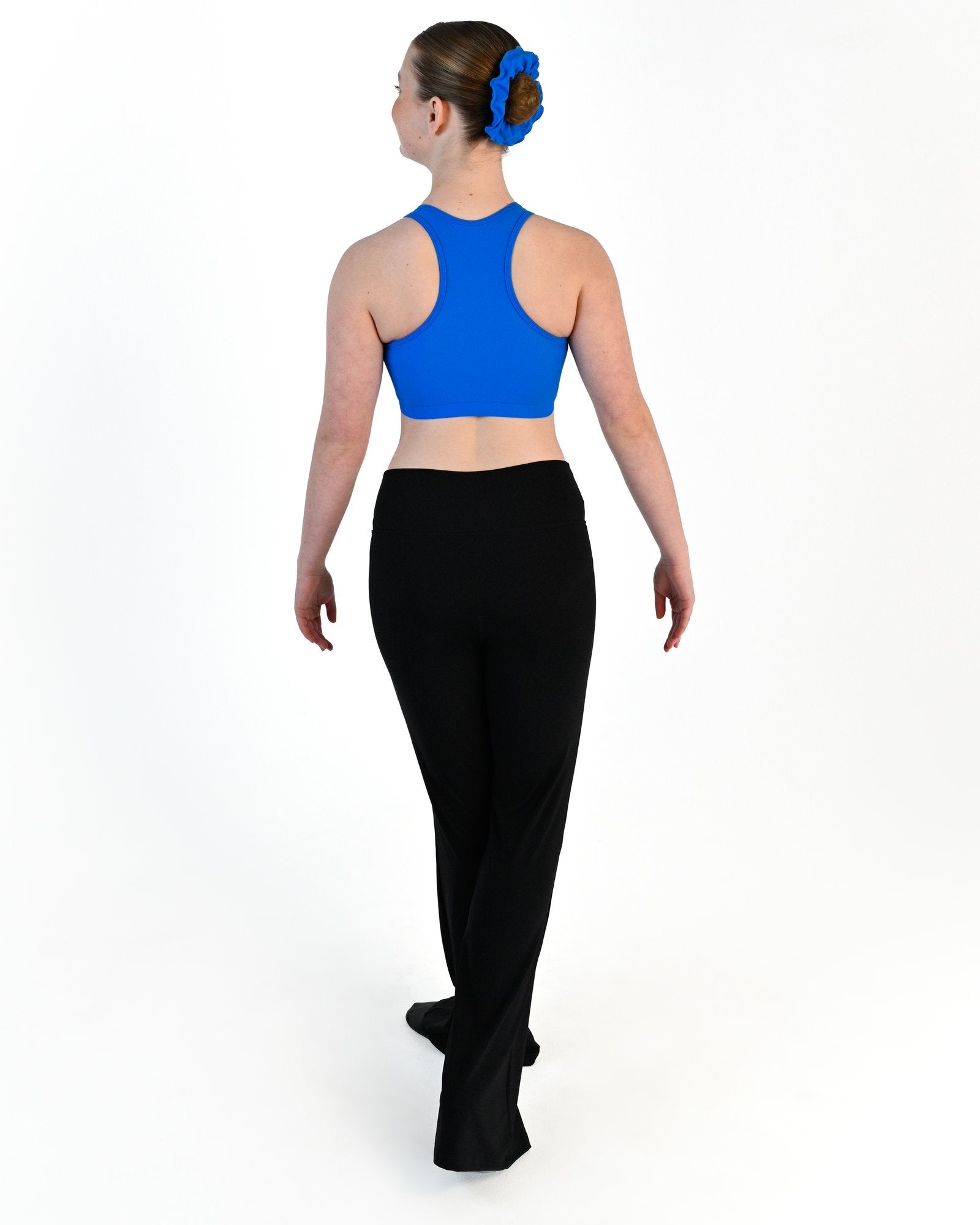 Young dancer wearing the Avery racerback dance crop top in Electric Blue, alternate view