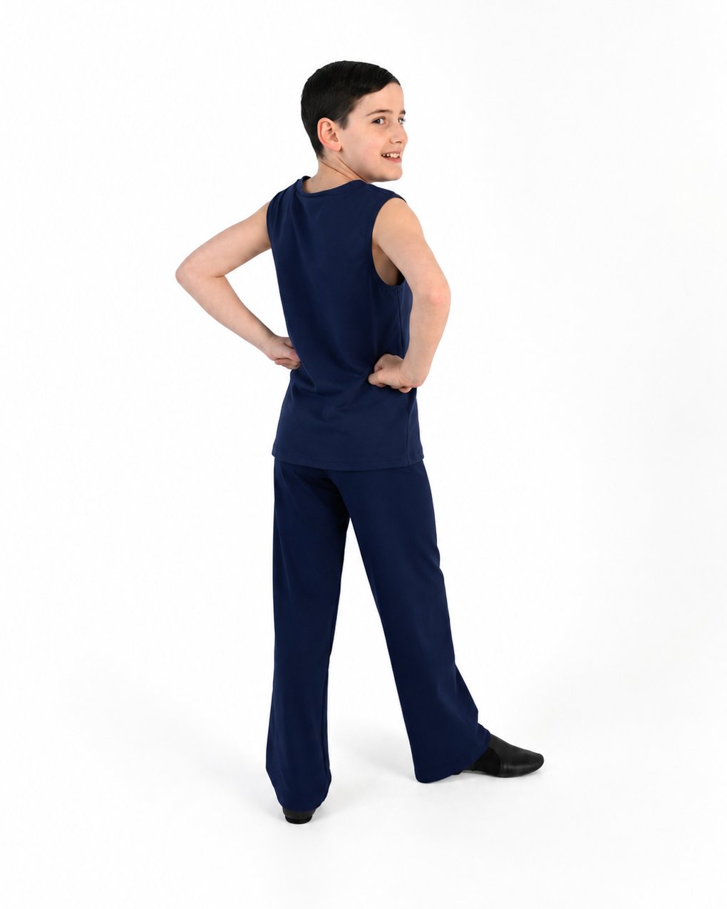 Young dancer wearing the Essential Boys Straight Leg Dance Pant in Navy
