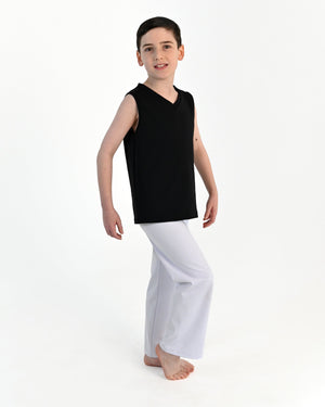 Young dancer wearing the Essential Boys Straight Leg Dance Pant in White, alternate view