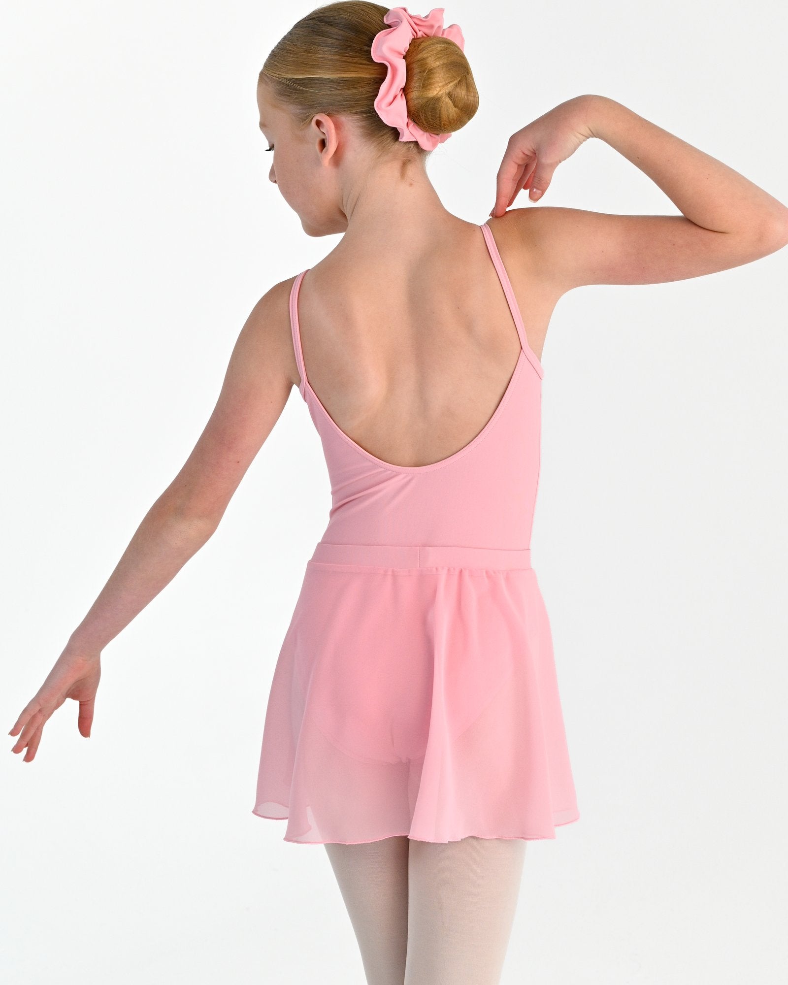 Young dancer wearing the Chiffon Pull-On Ballet Wrap Skirt in Pink, alternate view