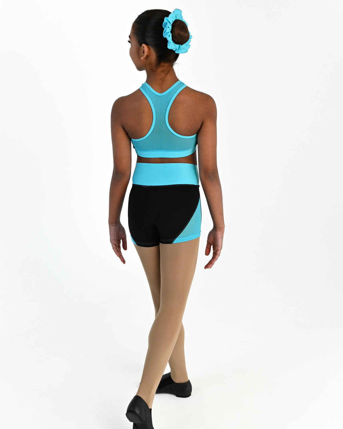 Young dancer wearing the Electra mesh panel high waisted dance shorts in Lagoon, alternate view