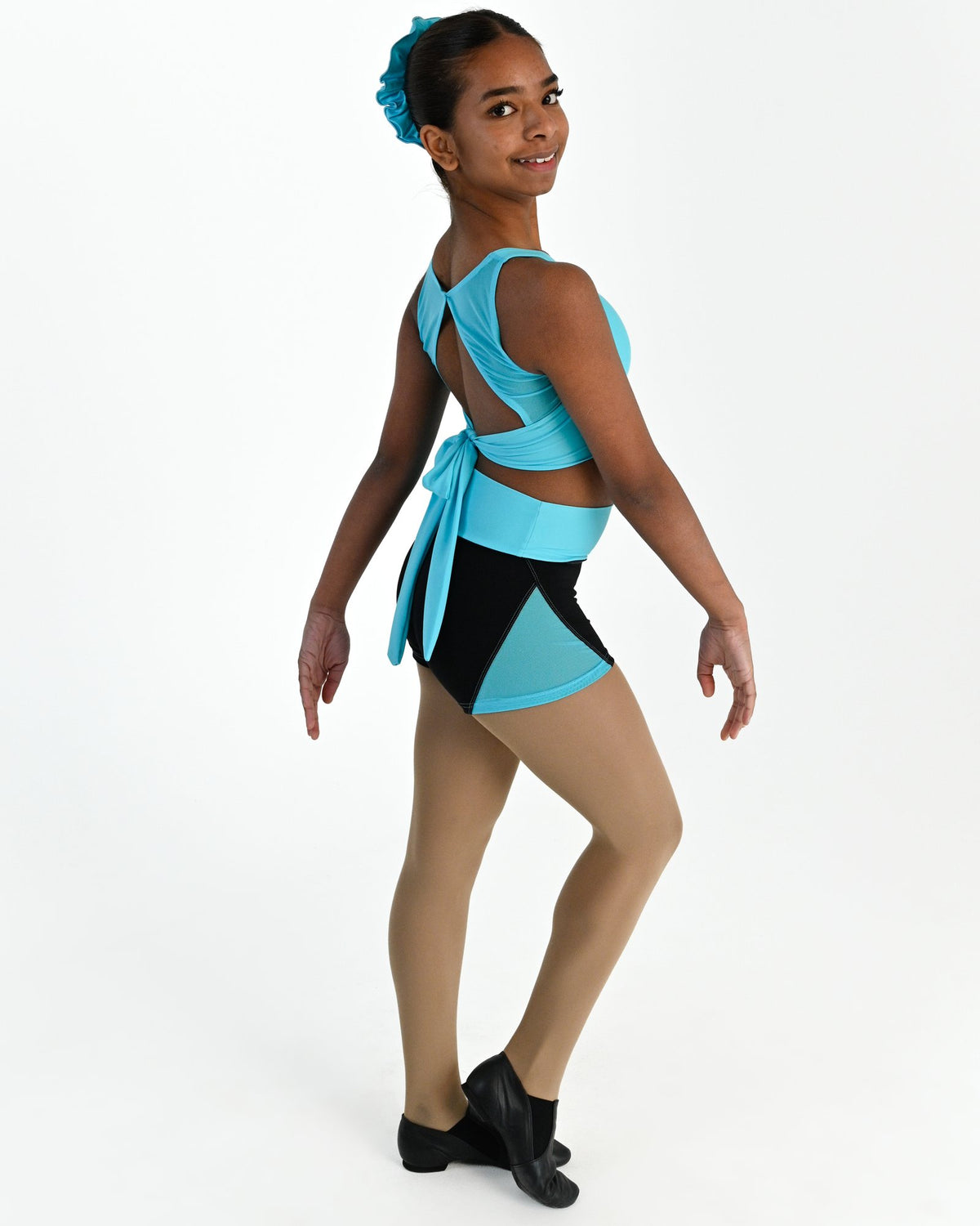 Young dancer wearing the Electra mesh panel high waisted dance shorts in Lagoon, alternate view