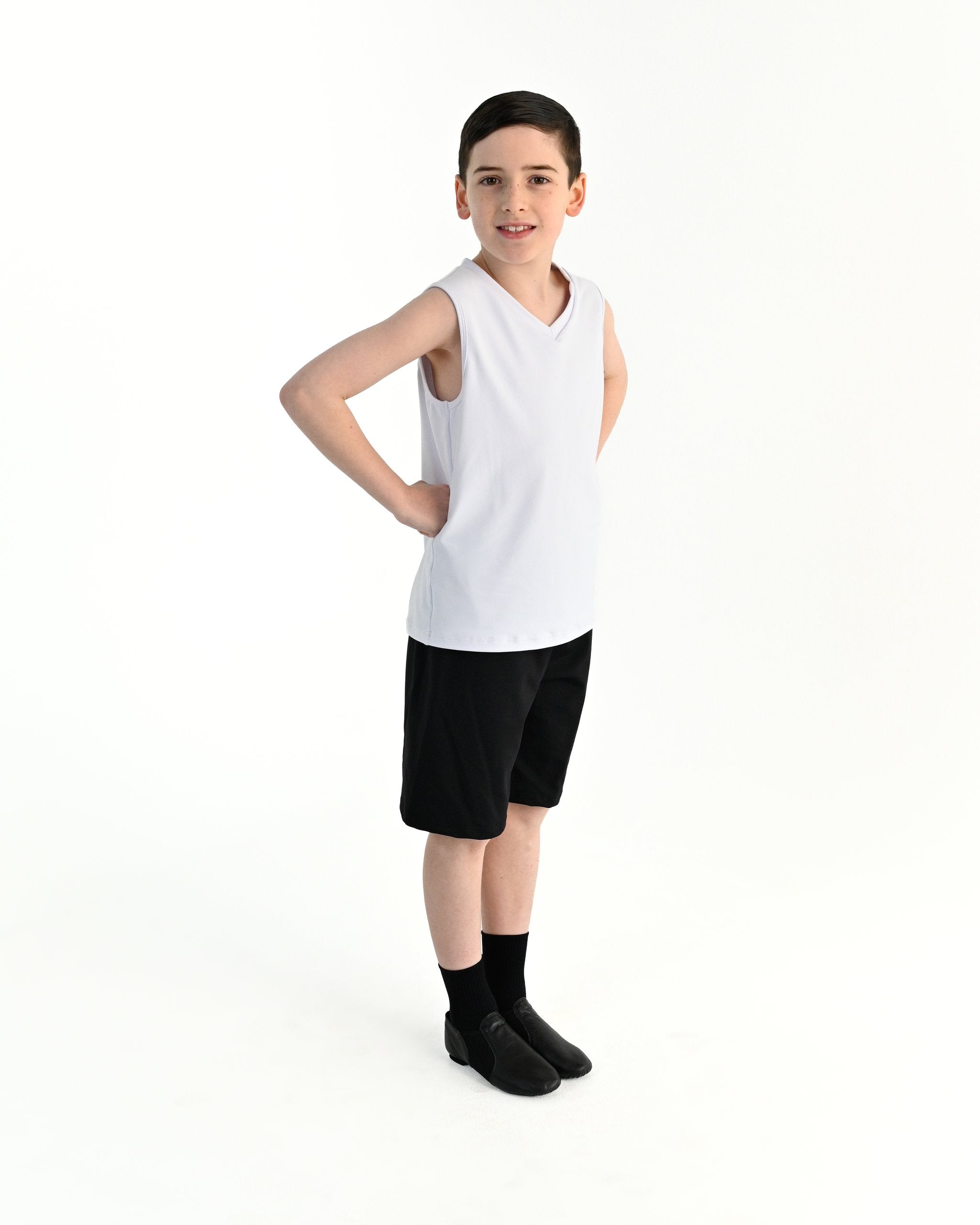 Young dancer wearing the Essential Boys Casual Dance Shorts in Black