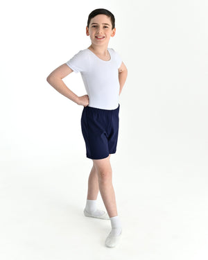 Young dancer wearing the Essential Boys Basic Dance Shorts in Navy