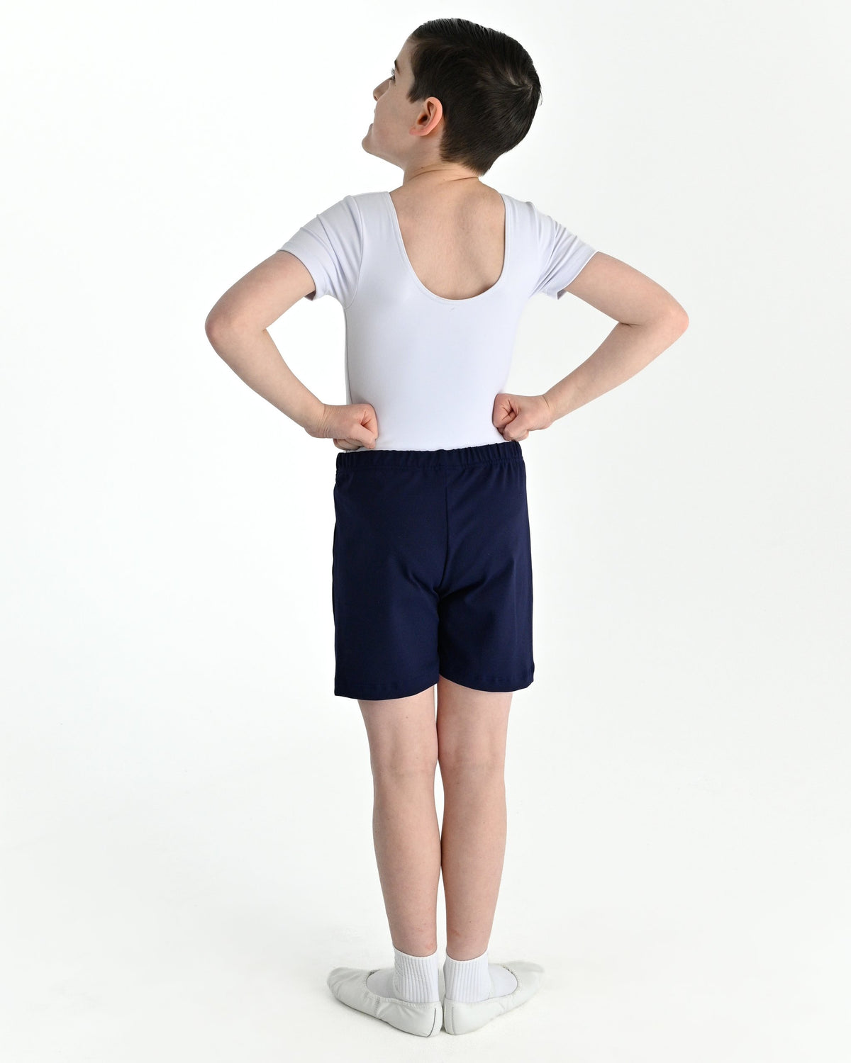 Young dancer wearing the Essential Boys Basic Dance Shorts in Navy, alternate view