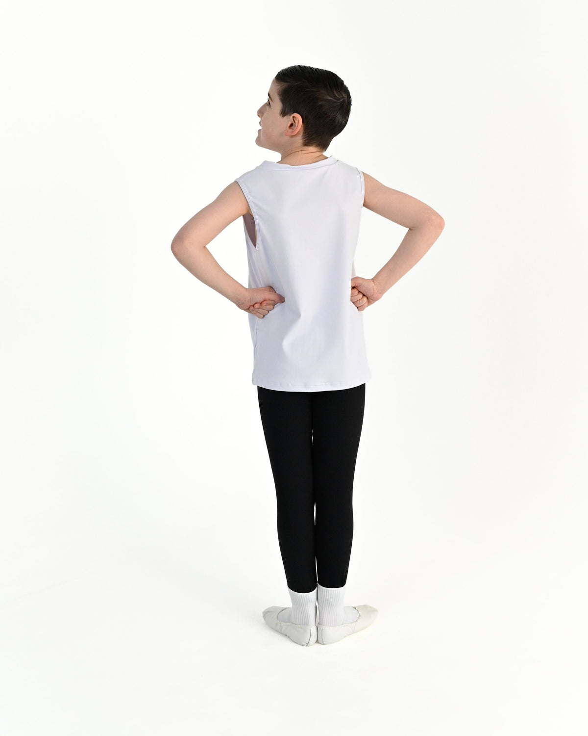 Young dancer wearing the Essential Boys Dance Tank in White, alternate view