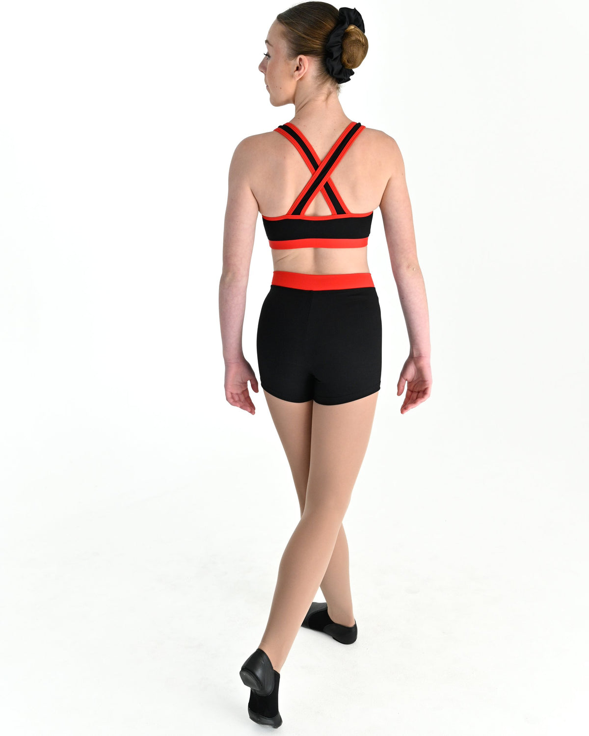 Young dancer wearing the V Band Shorts in Red, alternate view