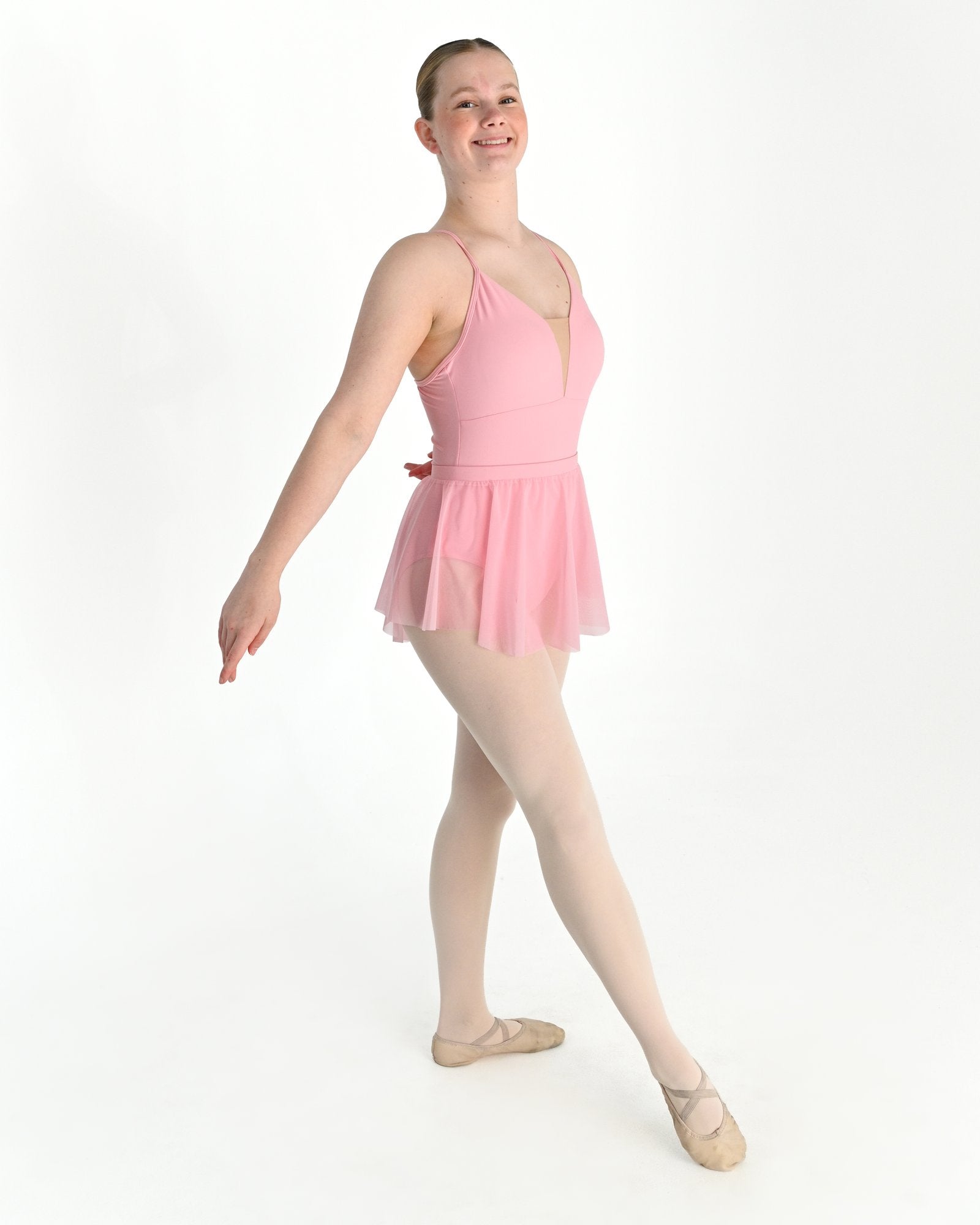 Young dancer wearing the Estelle stretch mesh pull on ballet skirt in Pink
