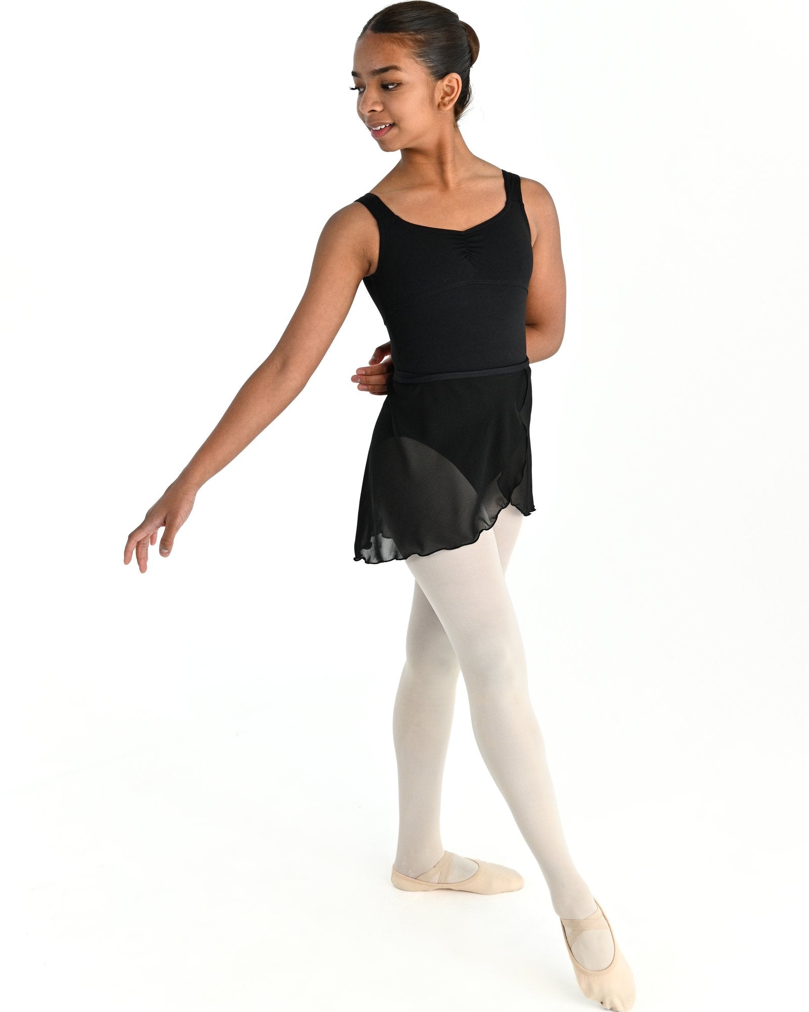 Young dancer wearing the Mesh Pull-On Ballet Wrap Skirt in Black