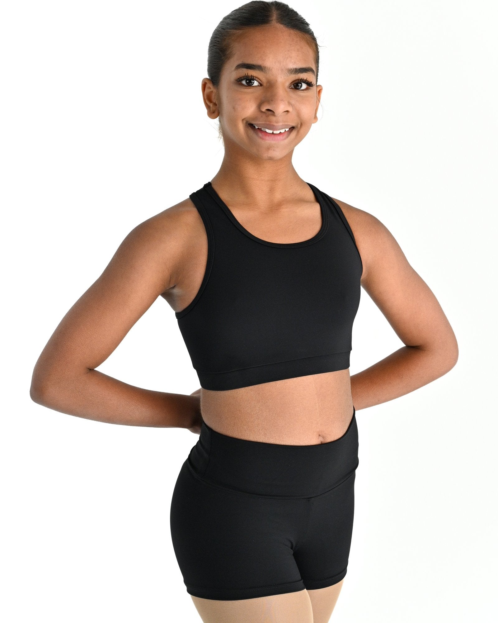 Young dancer wearing the Onyx power mesh racerback dance crop top in Black