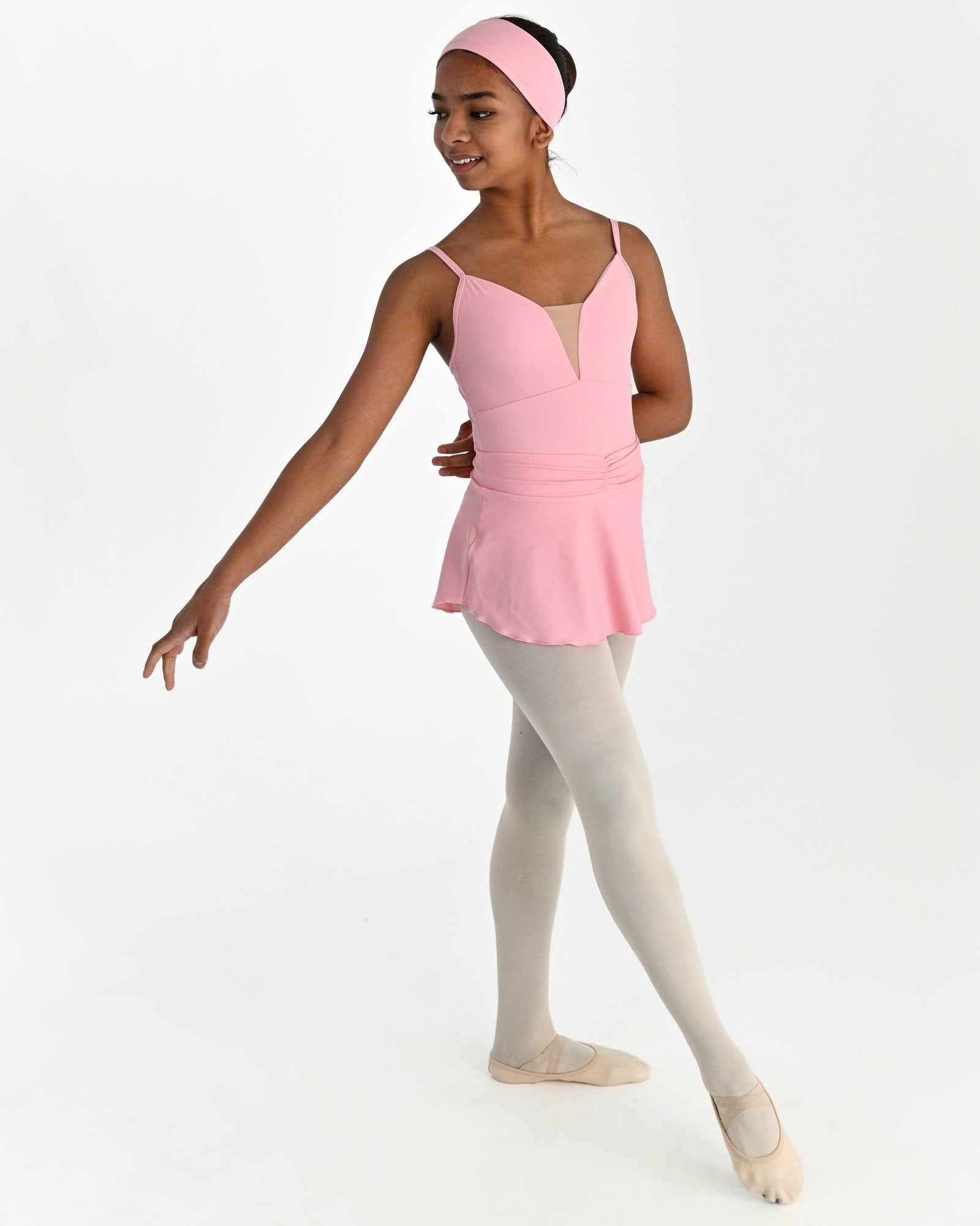 Young dancer wearing the Prima high low pull on ballet skirt in Pink